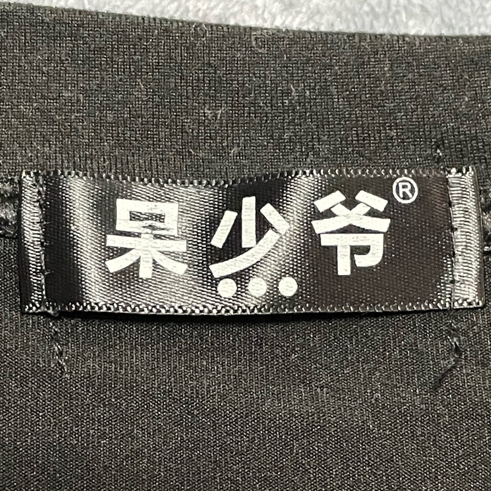 Black short sleeve shirt with back design shown in pictures .